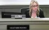 An image of Peoria Unified School District's Governing Board President Heather Rooks, looking off into the distance wearing a black blazer, a white blouse and black glasses.